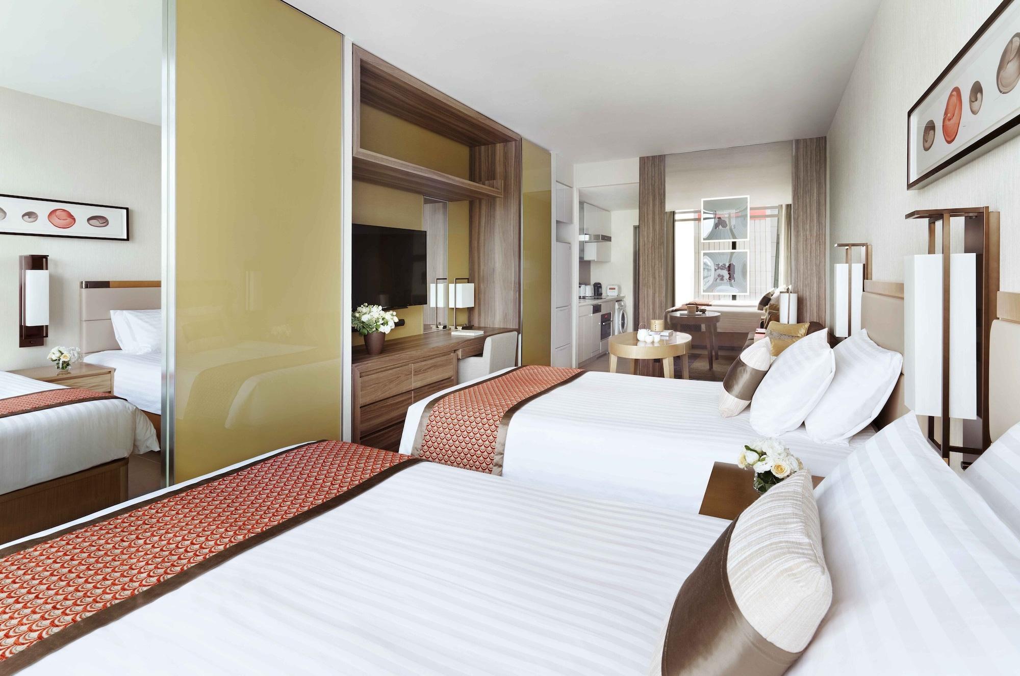 Oakwood Premier Tokyo Hotel Exterior foto A typical room at the hotel