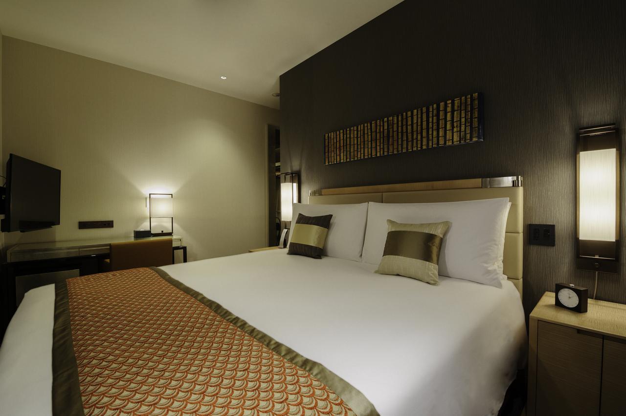Oakwood Premier Tokyo Hotel Exterior foto A bedroom at the hotel